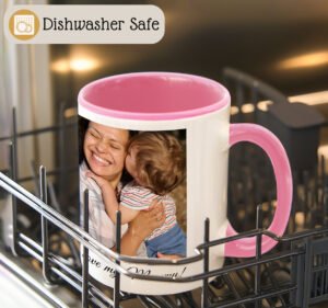 Mug with pink interior and handle in a dishwasher, featuring a printed design of a woman and child.