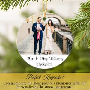 Personalized Wedding Photo Christmas ornament with a photo of a couple and text on a green leafy background