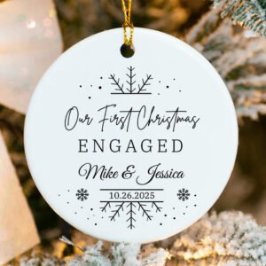 Engagement announcement ornament with ribbon banner reading We’re Engaged and custom names & date